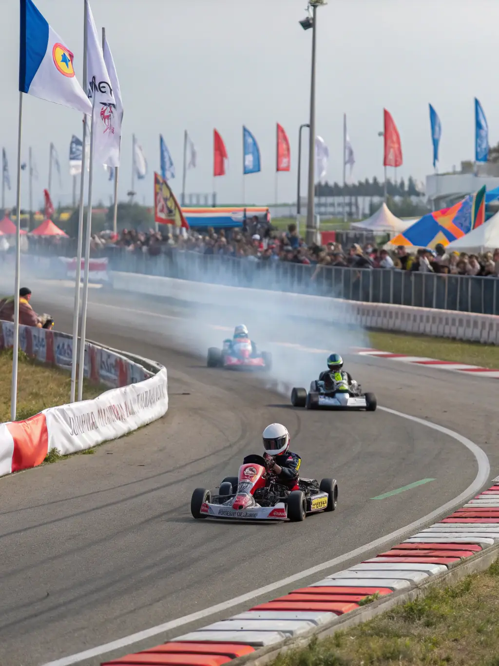 A dynamic shot of experienced kart-cross racers navigating a challenging dirt track, demonstrating the advanced skills taught in the program.