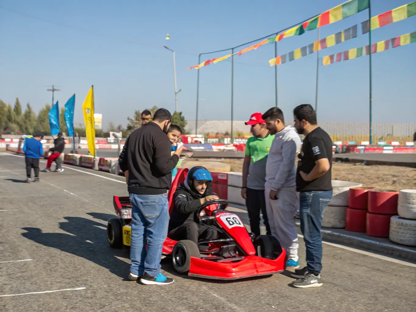 An image of community members participating in a SPRINTCAR DUNOIS event, showcasing the organization's commitment to social engagement and community development. The image should convey a sense of inclusivity and community spirit.